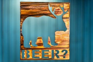 Beer Bear Deer Metal Art is a square piece of metal with a bear with deer antlers and the phrase Beer? in below the image.