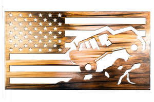 Metal wall art depicting a Jeep climbing a mountain inside an American Flag with a Wood Grain Copper Patina finish on the metal. This photo shows the metal art without the background