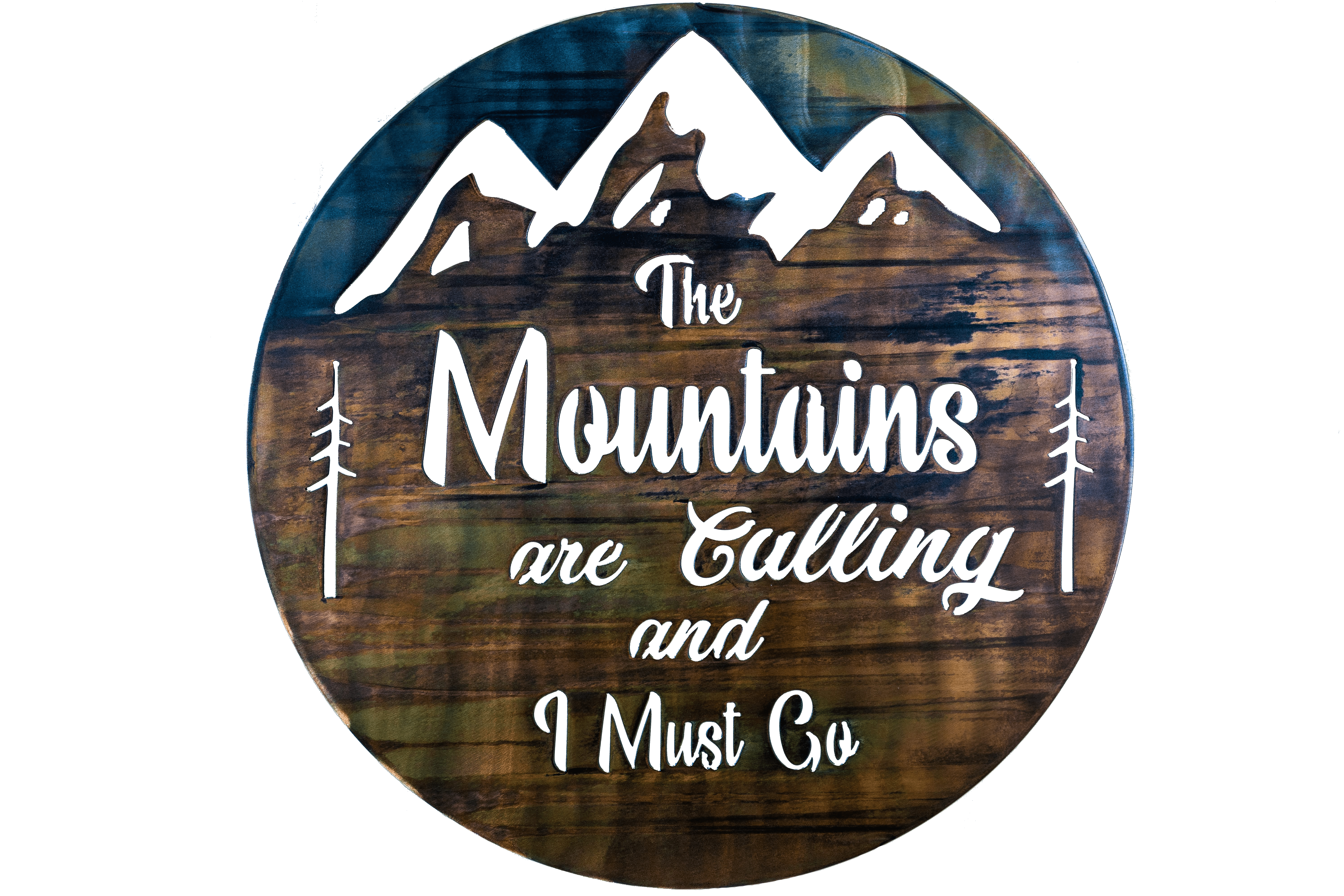 The Mountains are calling and I must go metal wall art is a circular piece of metal with the phrase cut into the metal with mountains in the background. This photo shows the metal art without the background.