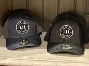 Photo of Artful Ellijay Home Provisions LIJ hats display with Father's Day gifts and gifts for him. This photo was taken at Artful Ellijay a retail store in Downtown Ellijay, GA.