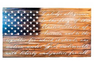 Metal Art Wall Decor of Metal American Flag with the Pledge of Allegiance cut into the steel. This picture has the background removed so you can see the detail of the bold words cut into the metal. This MetalWorx of Art is finished with a multi-color patina.